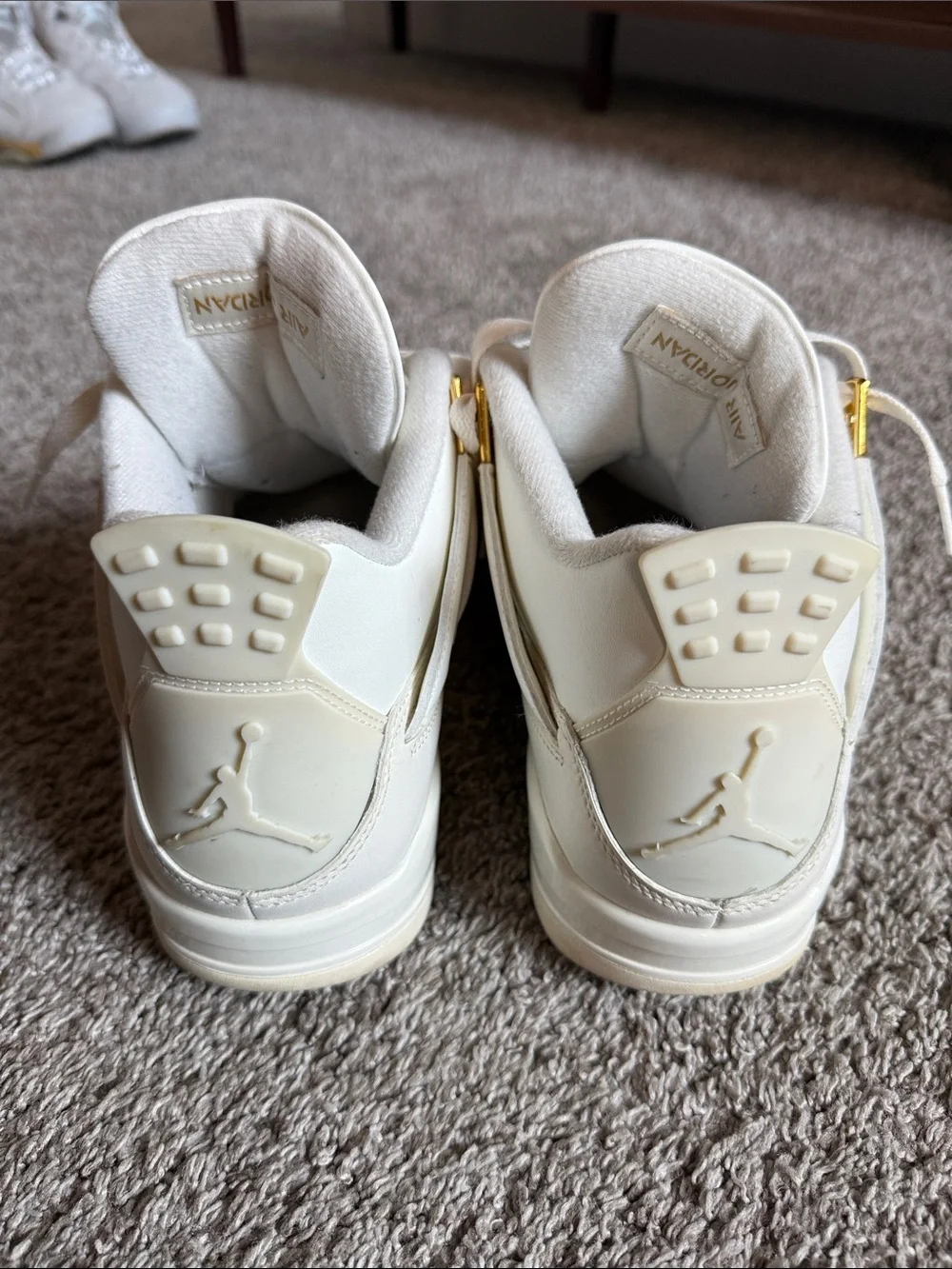 Jordan All-White Leather Sneakers with Gold Accents